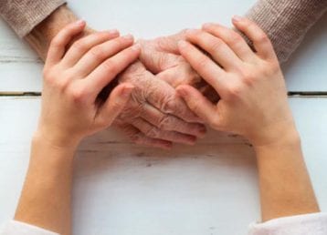 38163543 - unrecognizable grandmother and her granddaughter holding hands. 38163543 - unrecognizable grandmother and her granddaughter holding hands.